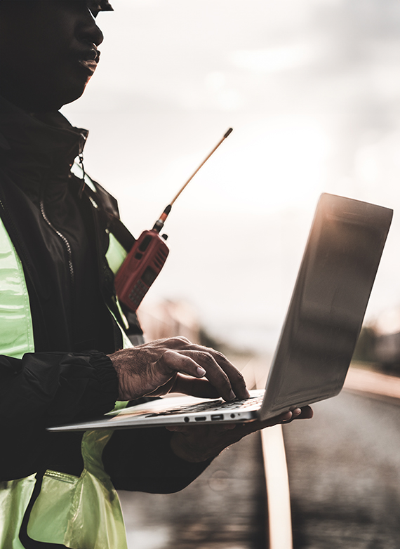 south-carolina-construction-manager-working-on-a-laptop-at-a-construction-site